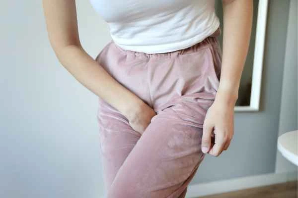woman running for the toilet because of urinary incontinence Hertford